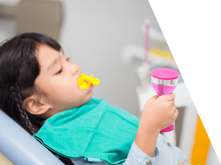 Child receiving fluoride treatment