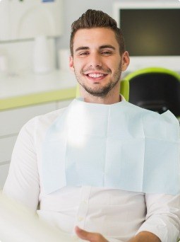 Man smiling after widom tooth extraction