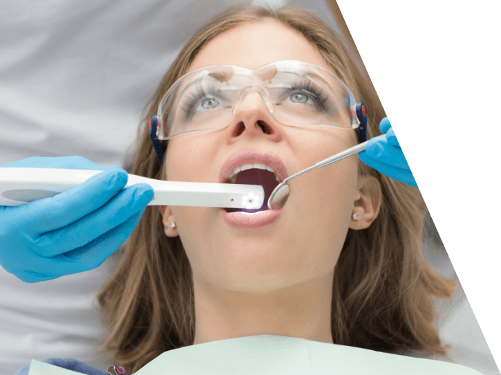Dentist using intraoral camera to capture smile images
