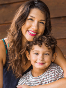 Mother and child smiling together after preventive dentistry visit