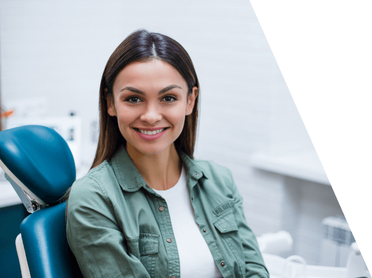 Woman smiling during preventive dentistry checkup and teeth cleaning visit