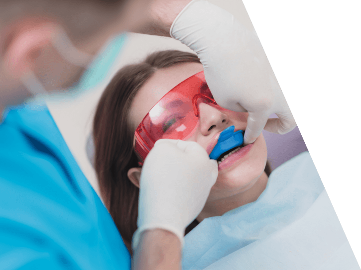 Dental patient receiving fluoride treatment