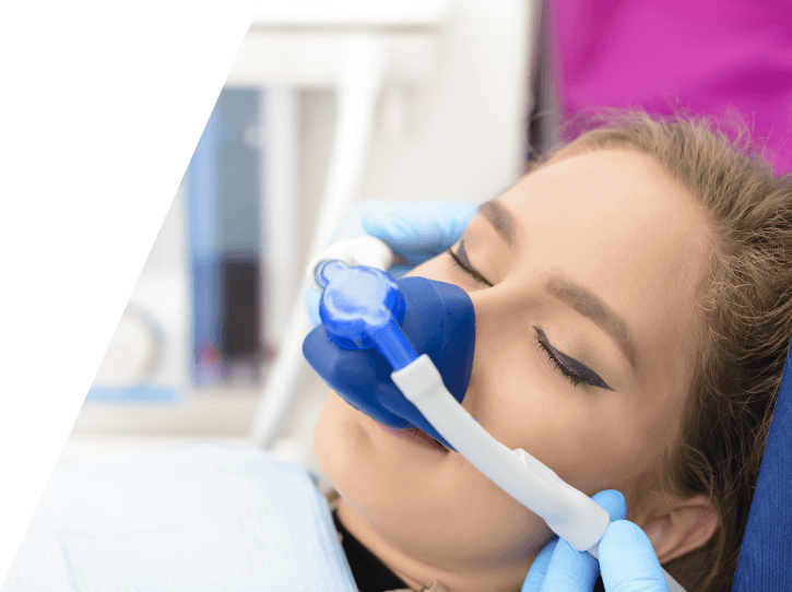 Woman with nitrous oxide dental sedation mask in place