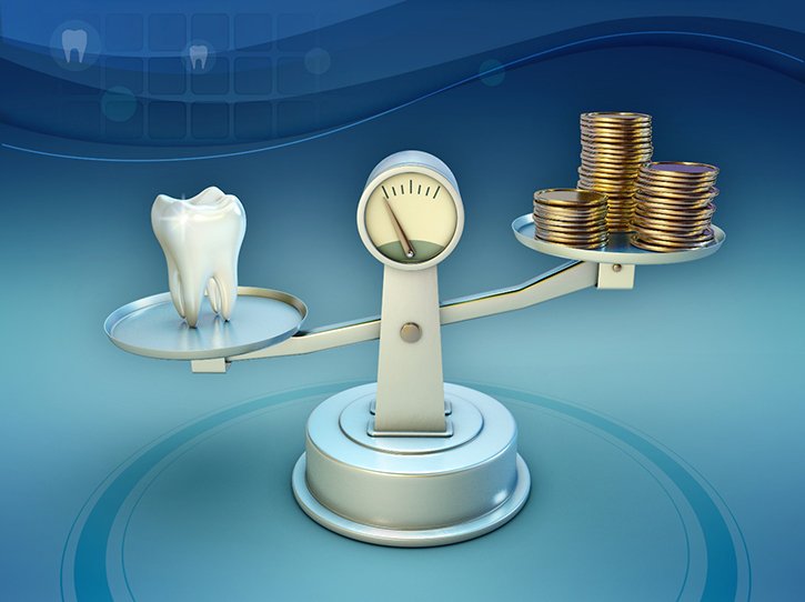 Tooth and coins on a balance scale