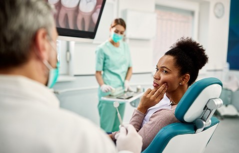 Woman in the dental chair with a toothache