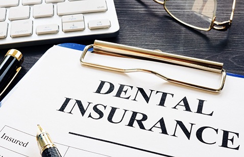 Dental insurance form on a clipboard
