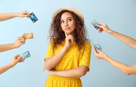 Woman surrounded by credit cards