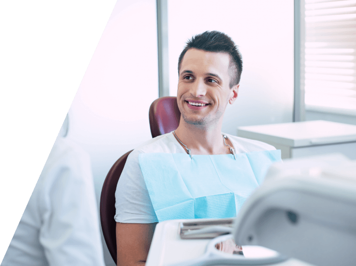 Man smiling during wisdom tooth extraction visit